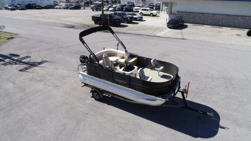 Slide: The Image of 2018 Lexington 5 Series pontoon boat parked on trailer. - 5
