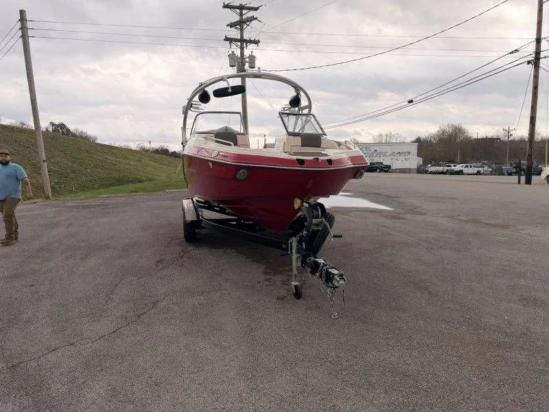 Slide: The Image of Red 2014 Yamaha 242 Limited S boat on trailer. - 15