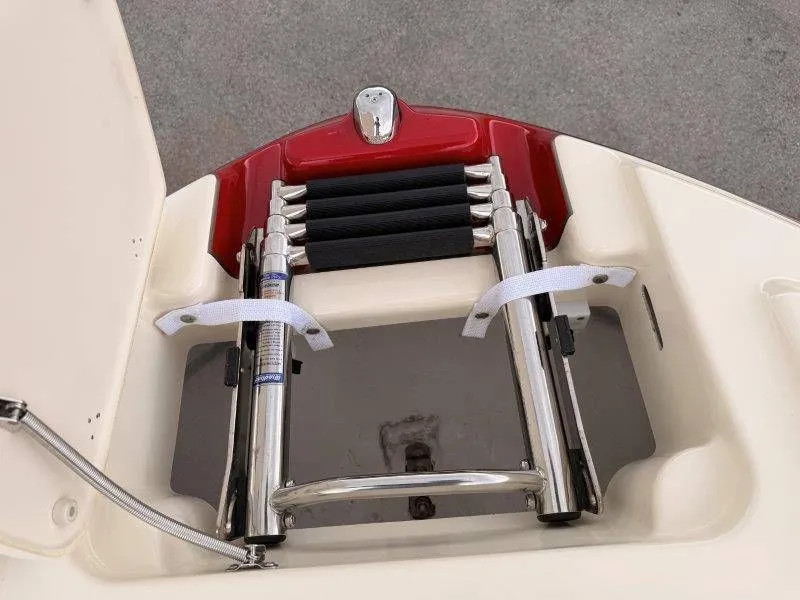 Slide: The Image of Yamaha 242 Limited S 2014 boat ladder, stainless steel with red accents. - 18
