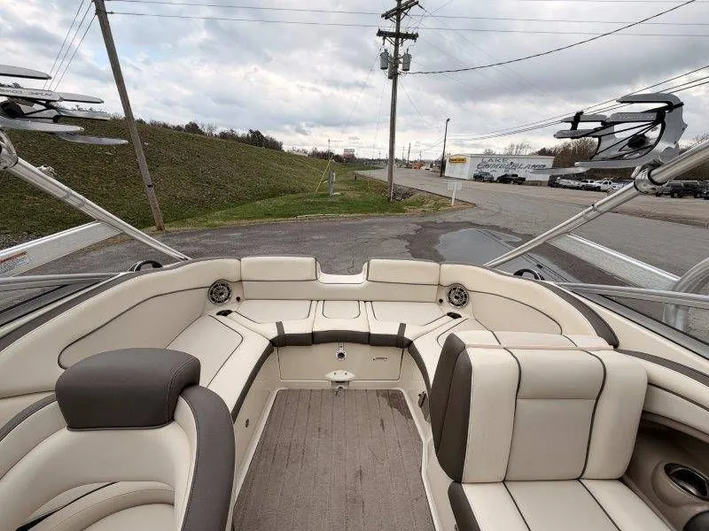 Slide: The Image of Interior of a 2014 Yamaha Boats 242 Limited S with beige seating. - 24