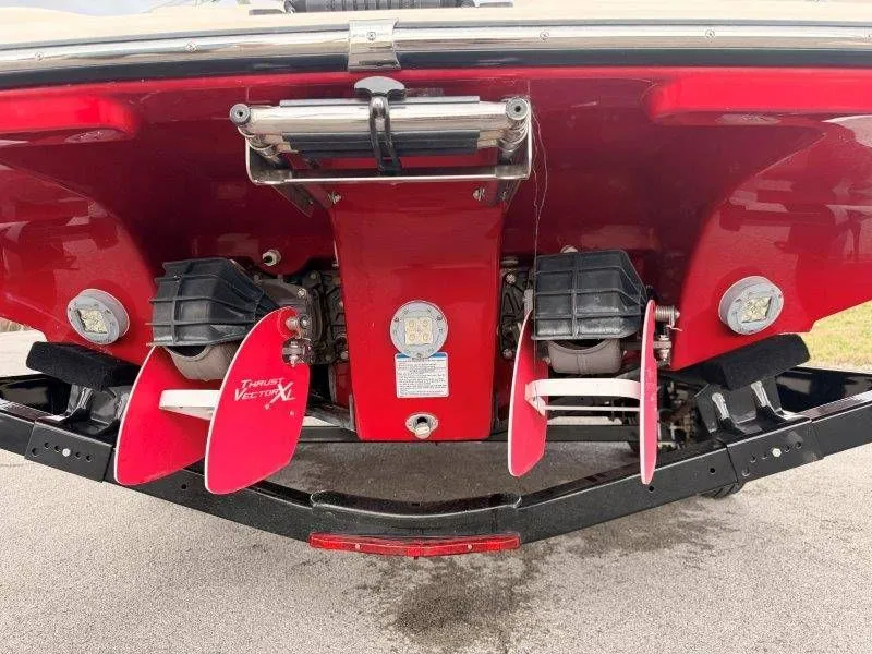 Slide: The Image of Rear view of a 2014 Yamaha Boats 242 Limited S with red hull. - 27