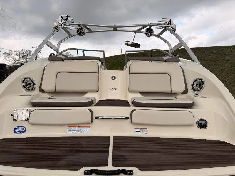 Slide: The Image of Rear view of a 2014 Yamaha 242 Limited S boat with seating area. - 28