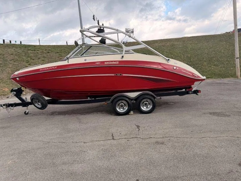 Slide: The Image of Red 2014 Yamaha Boats 242 Limited S on trailer. - 4