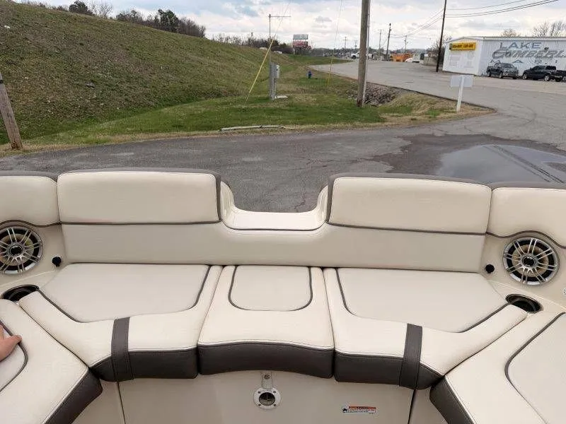 Slide: The Image of Interior of a 2014 Yamaha Boats 242 Limited S with beige seating. - 49
