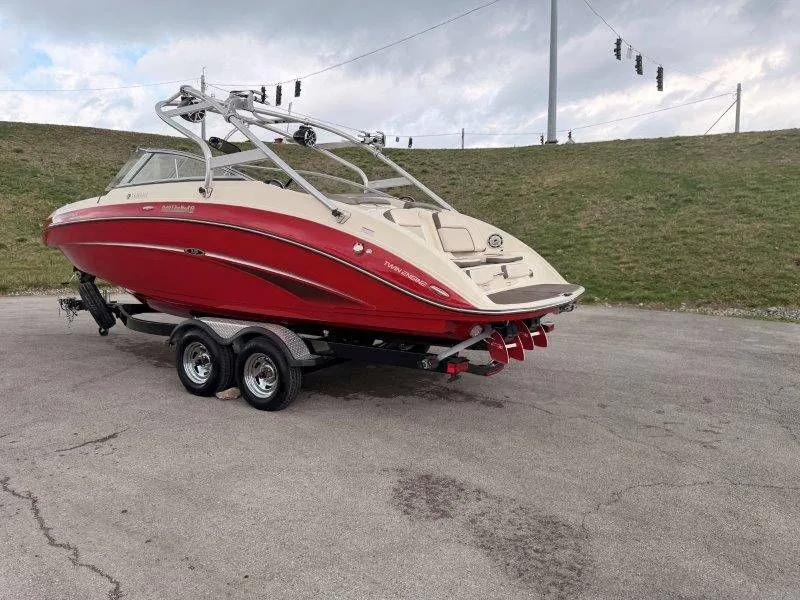 Slide: The Image of Red 2014 Yamaha Boats 242 Limited S on trailer. - 5