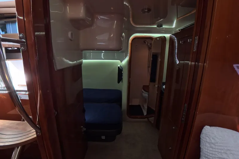 Slide: The Image of Interior of 2012 Regal 46 Sport Coupe yacht with cozy cabin and bathroom. - 7