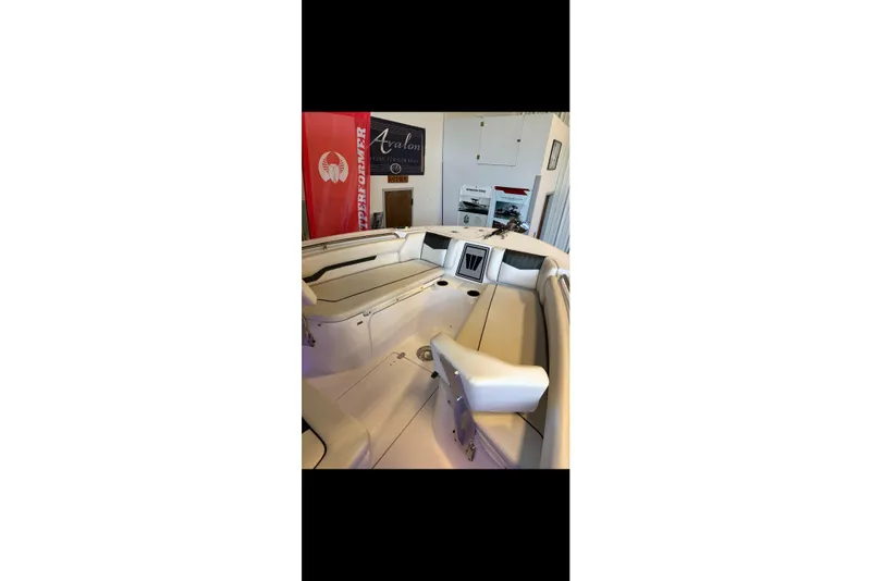Slide: The Image of 2024 Wellcraft 223 Fisherman boat interior with seating and storage compartments. - 5