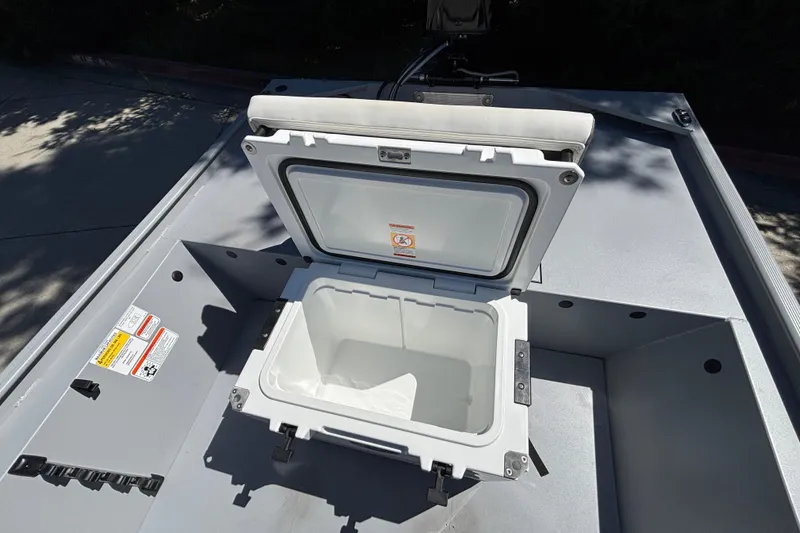 Slide: The Image of Open storage compartment on 2026 Tracker Bass Tracker Classic CC boat. - 22
