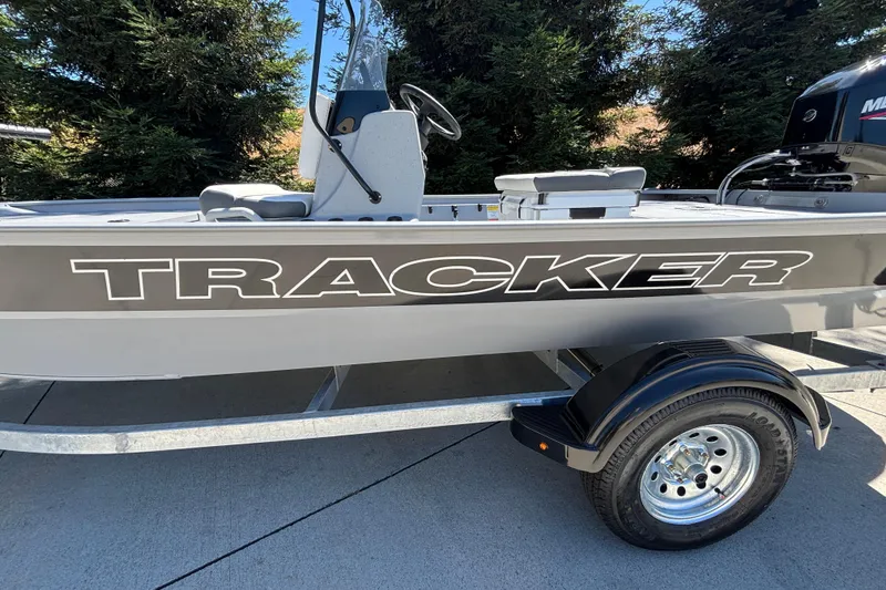 Slide: The Image of 2026 Tracker Bass Tracker Classic CC boat on trailer, side view with logo. - 7