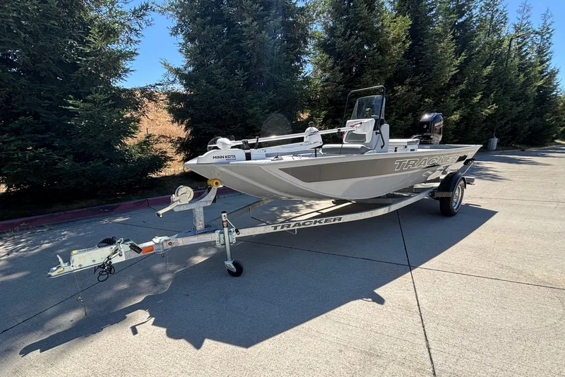 Slide: The Image of 2026 Tracker Bass Tracker Classic CC boat on trailer, parked outdoors. - 4