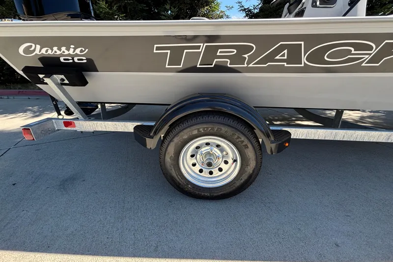 Slide: The Image of 2026 Tracker Bass Tracker Classic CC boat on trailer, side view. - 11