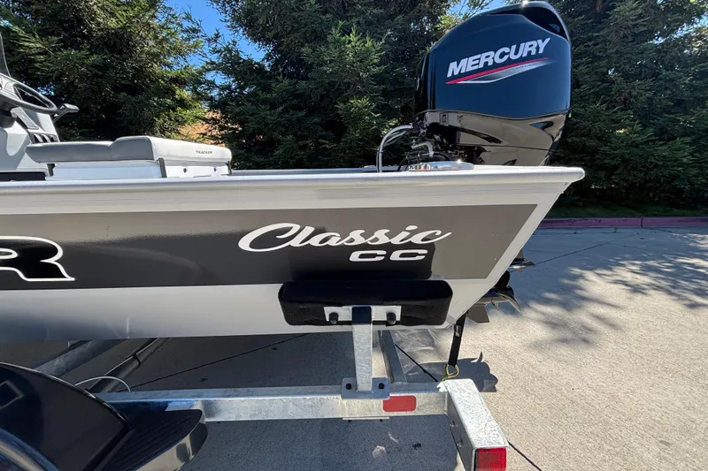 Slide: The Image of 2026 Tracker Bass Tracker Classic CC boat with Mercury engine on trailer. - 8