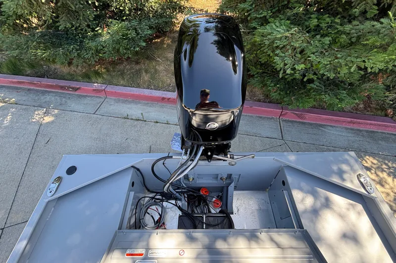 Slide: The Image of 2026 Tracker Bass Tracker Classic CC boat engine and interior view. - 19