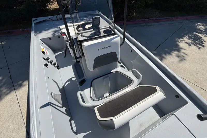 Slide: The Image of 2026 Tracker Bass Tracker Classic CC boat interior with console and seating. - 26