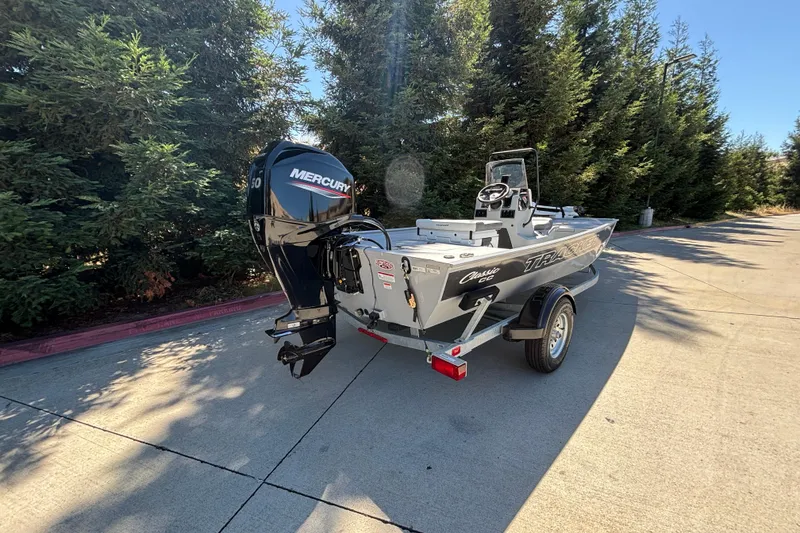 Slide: The Image of 2026 Tracker Bass Tracker Classic CC boat with Mercury engine on a trailer. - 6