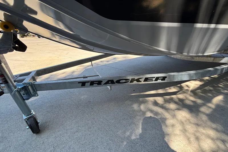 Slide: The Image of 2026 Tracker Bass Tracker Classic CC boat trailer on concrete surface. - 25