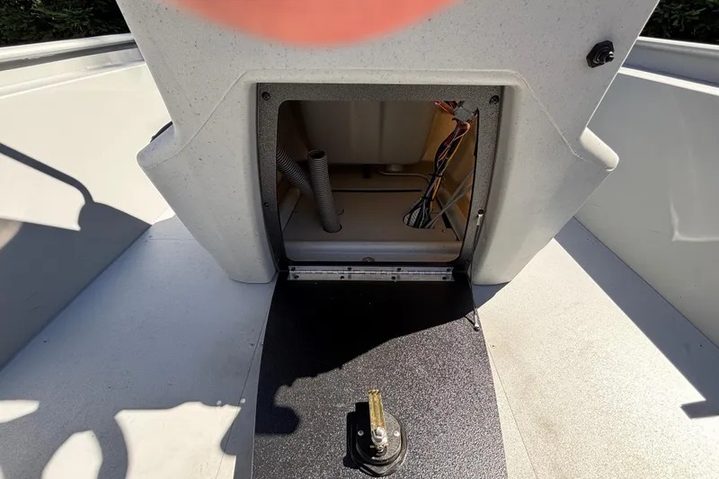 Slide: The Image of 2026 Tracker Bass Tracker Classic CC boat interior showing storage compartment and wiring. - 14