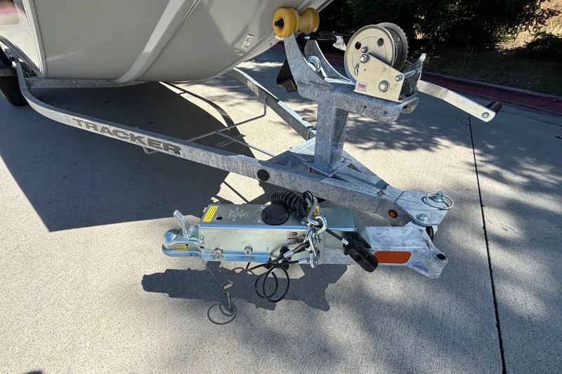 Slide: The Image of Trailer hitch of 2026 Tracker Bass Tracker Classic CC boat on pavement. - 24