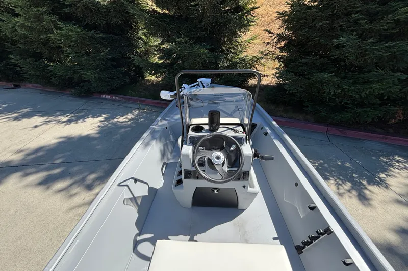 Slide: The Image of 2026 Tracker Bass Tracker Classic CC boat interior with steering wheel and console. - 18
