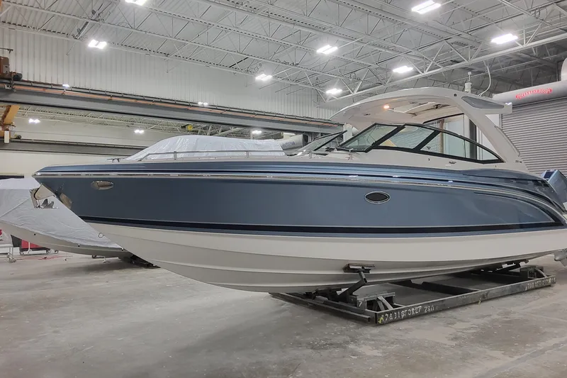 The Image of 2026 Formula 330 Crossover Bowrider OB in a showroom, showcasing sleek design and modern features. - 1