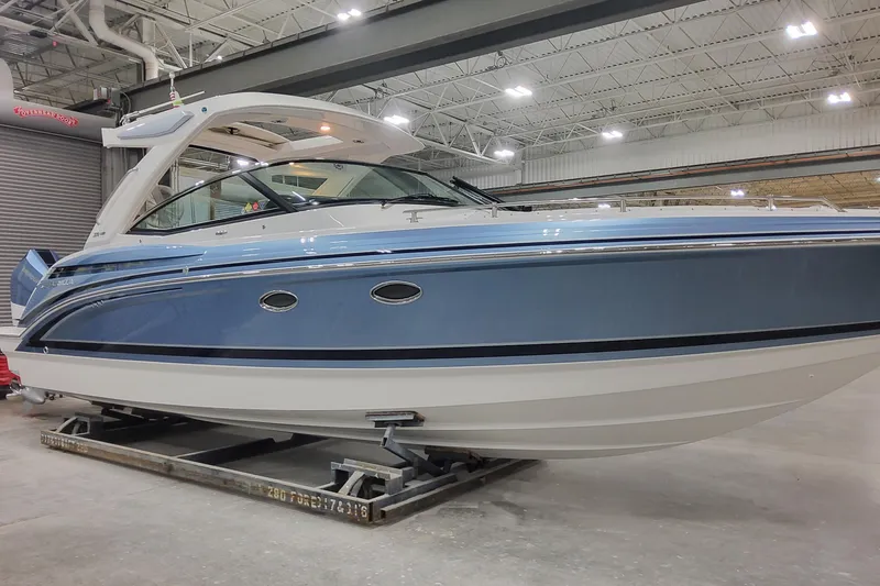 Slide: The Image of 2026 Formula 330 Crossover Bowrider OB in a showroom, showcasing sleek design and modern features. - 2