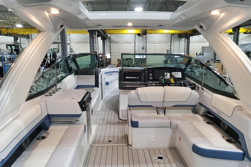 Slide: The Image of 2026 Formula 330 Crossover Bowrider OB interior with luxurious seating and modern dashboard. - 21