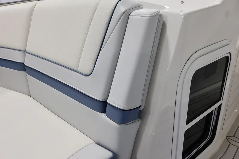 Slide: The Image of 2026 Formula 330 Crossover Bowrider OB interior seating detail with blue and white upholstery. - 27