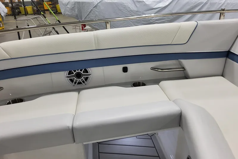Slide: The Image of 2026 Formula 330 Crossover Bowrider OB interior with cushioned seating and speaker. - 29