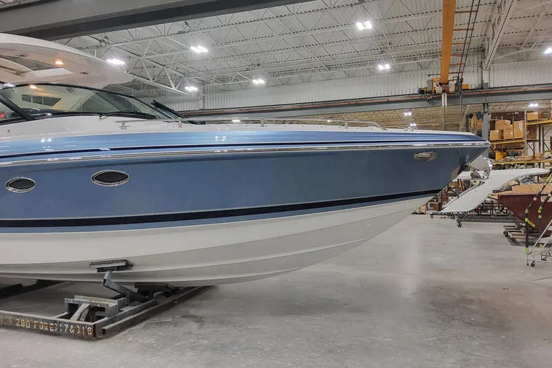 Slide: The Image of 2026 Formula 330 Crossover Bowrider OB in a warehouse setting. - 3