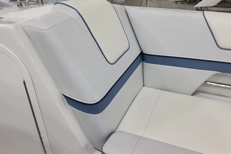 Slide: The Image of 2026 Formula 330 Crossover Bowrider OB interior seating with white and blue upholstery. - 34