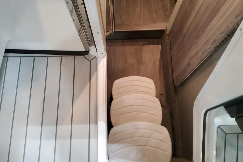 Slide: The Image of Interior view of 2026 Formula 330 Crossover Bowrider OB, featuring sleek flooring and seating. - 43