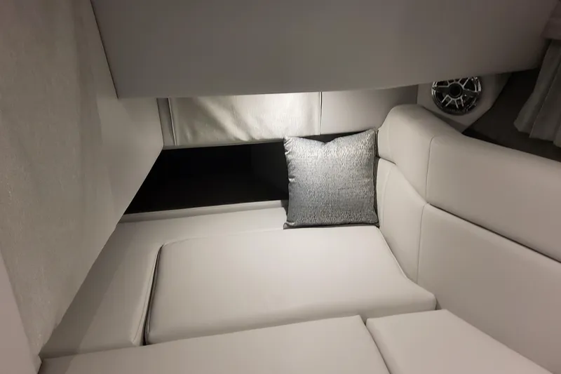 Slide: The Image of Interior of 2026 Formula 330 Crossover Bowrider OB, featuring sleek white seating and a cushion. - 45