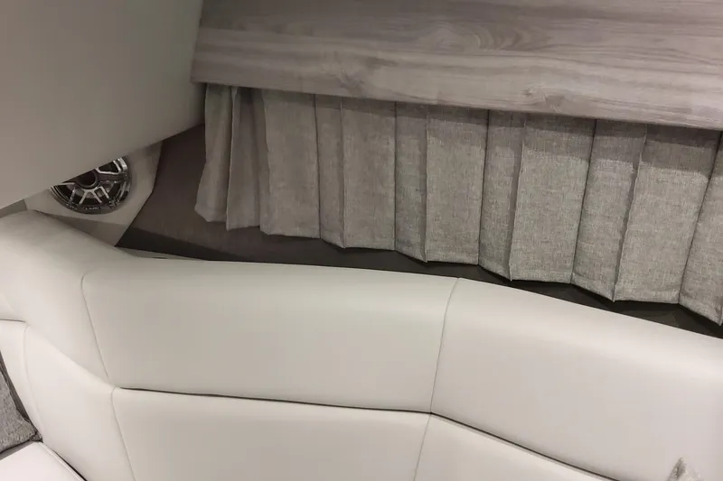 Slide: The Image of Interior of 2026 Formula 330 Crossover Bowrider OB with plush seating and elegant curtains. - 46
