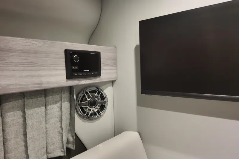 Slide: The Image of Interior of 2026 Formula 330 Crossover Bowrider OB with audio system and TV. - 47