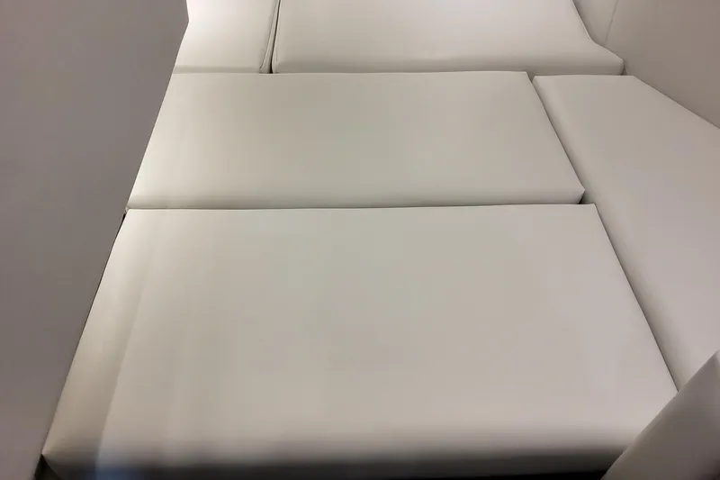 Slide: The Image of 2026 Formula 330 Crossover Bowrider OB interior seating, featuring sleek white cushions. - 51