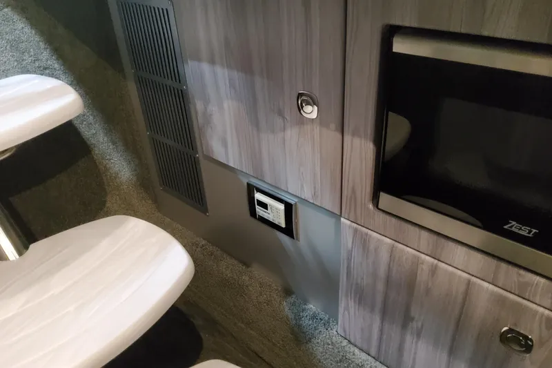 Slide: The Image of Interior of 2026 Formula 330 Crossover Bowrider OB, featuring modern cabinetry and appliances. - 57