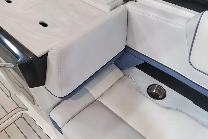 Slide: The Image of 2026 Formula 330 Crossover Bowrider OB interior seating with cup holder detail. - 61