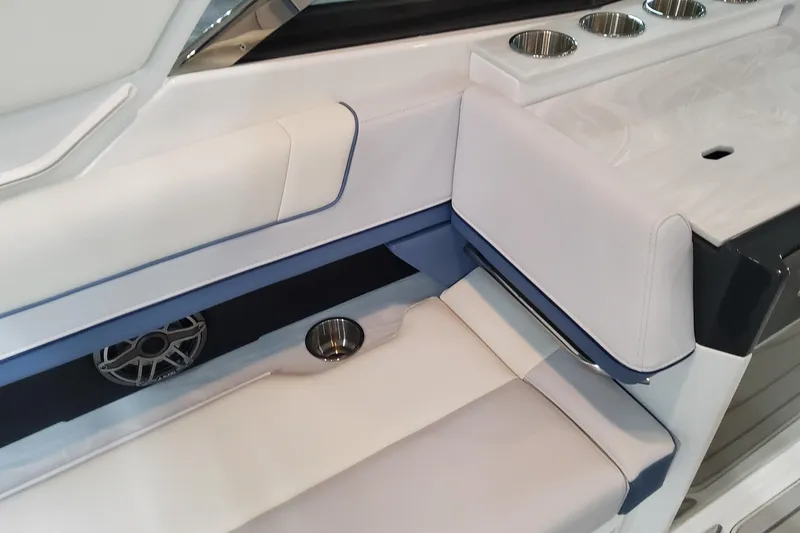 Slide: The Image of 2026 Formula 330 Crossover Bowrider OB interior with white seating and cup holders. - 62