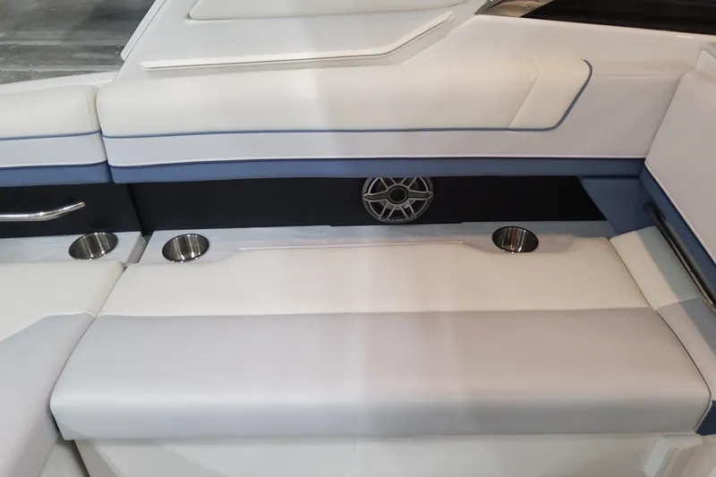 Slide: The Image of 2026 Formula 330 Crossover Bowrider OB interior seating with cup holders and speaker. - 63