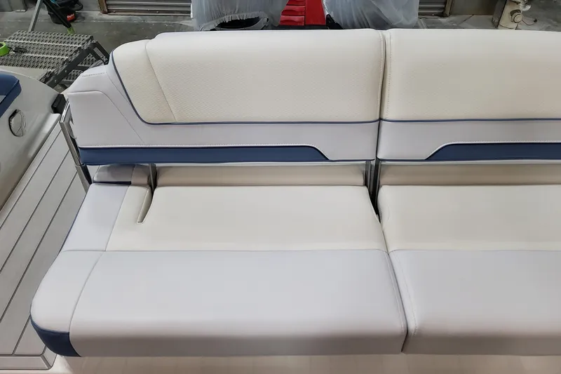 Slide: The Image of 2026 Formula 330 Crossover Bowrider OB interior seating, featuring sleek white and blue upholstery. - 68