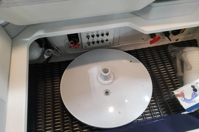 Slide: The Image of 2026 Formula 330 Crossover Bowrider OB interior compartment with controls and storage. - 73