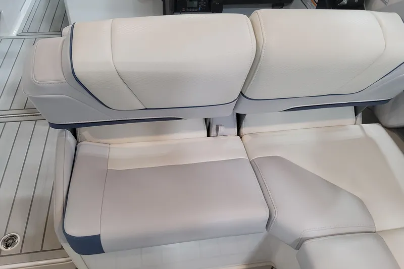 Slide: The Image of 2026 Formula 330 Crossover Bowrider OB interior seating, featuring luxurious white and gray upholstery. - 75