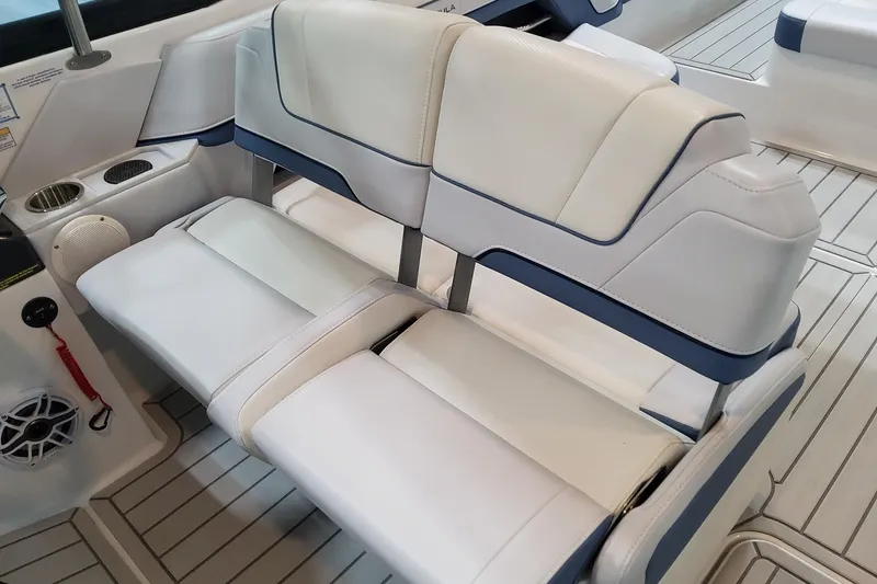 Slide: The Image of 2026 Formula 330 Crossover Bowrider OB interior seating with cup holders and speaker. - 78