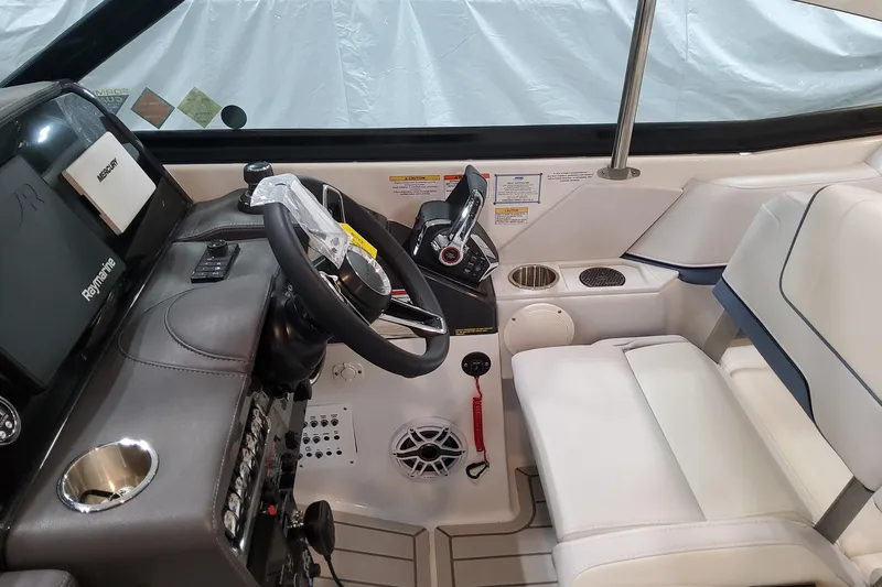 Slide: The Image of 2026 Formula 330 Crossover Bowrider OB cockpit with steering wheel and controls. - 79