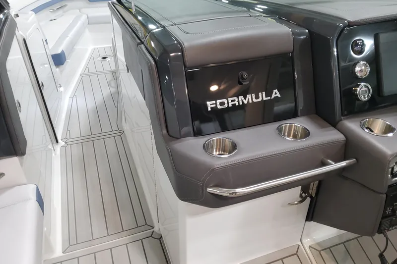 Slide: The Image of 2026 Formula 330 Crossover Bowrider OB interior with sleek design and cup holders. - 82