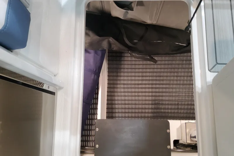 Slide: The Image of Interior view of 2026 Formula 330 Crossover Bowrider OB boat storage compartment. - 88