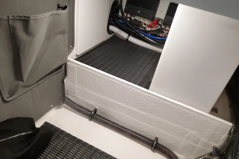 Slide: The Image of Interior view of 2026 Formula 330 Crossover Bowrider OB, showcasing wiring and storage area. - 89