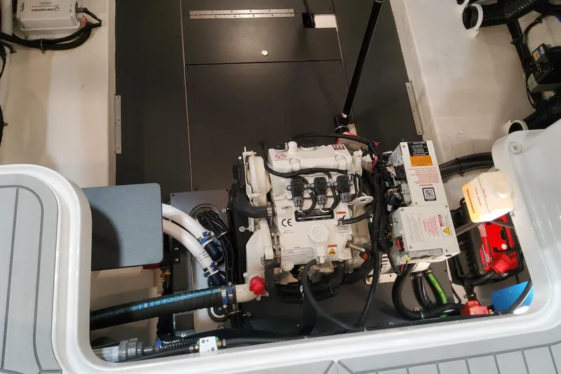 Slide: The Image of Engine compartment of 2026 Formula 330 Crossover Bowrider OB, showcasing mechanical components. - 92