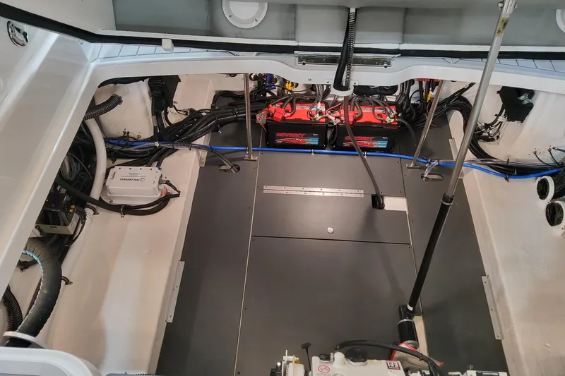 Slide: The Image of Engine compartment of 2026 Formula 330 Crossover Bowrider OB with batteries and wiring. - 93