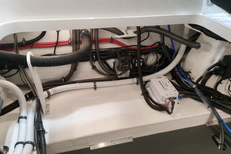 Slide: The Image of Engine compartment of 2026 Formula 330 Crossover Bowrider OB with wiring and components. - 98